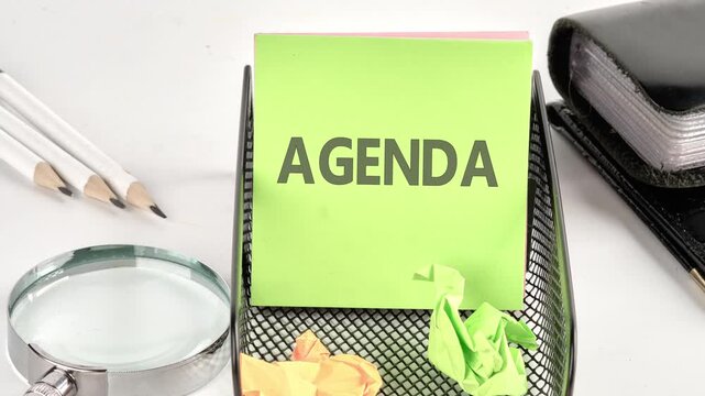 The word AGENDA appears on a green sticker. The concept of information business in the modern world