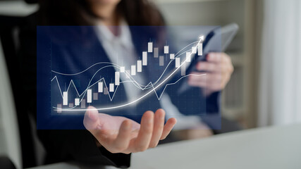 A business professional studies stock market trends using a tablet, showcasing digital graphs in a modern office setting, emphasizing financial growth and analysis. Impute