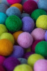 Colorful felt wool balls background, full frame