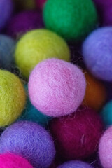 Colorful felt wool balls background, full frame