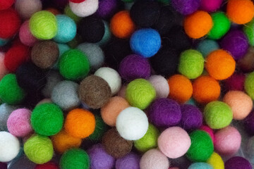 Colorful felt wool balls background, full frame