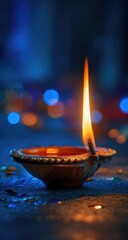A diya flame at night