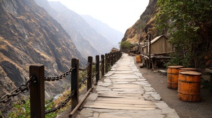 Fototapeta premium Scenic pathway along a mountain canyon with tents and barrels, showcasing nature's beauty and tranquility