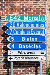 Road signs to the E 42 highway and major cities in Péruwelz, Hainaut, Belgium