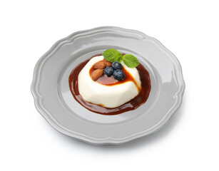 Tasty panna cotta with blueberries, almonds and sauce isolated on white