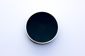 A circle with a gold frame surrounding it on a white background.