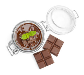 Delicious panna cotta in glass jar, pieces of chocolate and mint isolated on white, top view