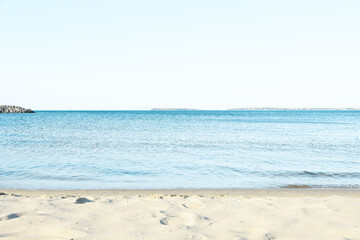 Beautiful sea and sandy beach under cloudless sky