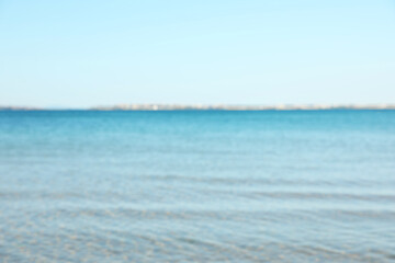Beautiful sea under light blue sky, blurred view