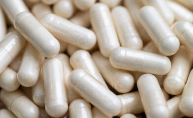 Close up of Light Capsules Filled with Natural Supplement Powder