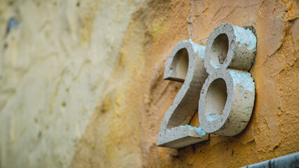 ols house number on the wall 28