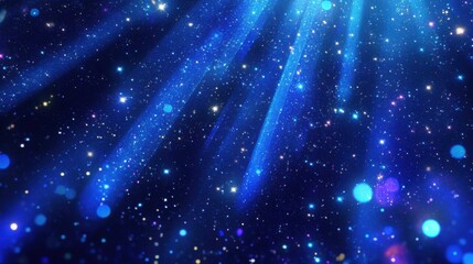 Obraz premium Ethereal blue light rays shining through a starry night sky backdrop