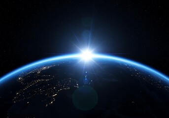 Sunrise over the earth from space, illuminating the planets atmosphere