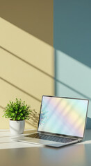 Fototapeta premium Modern laptop on a desk with a potted plant, bathed in sunlight and shadow patterns, creating a serene work environment