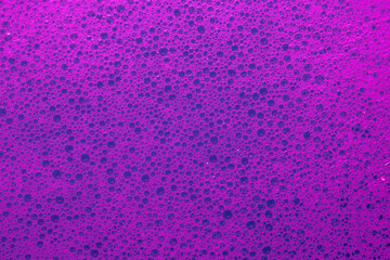 Abstract sponge-like foam with multicolored tints and visible pores, ideal for playful, fresh, and creative visuals.