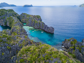 Big Lagoon and Small Lagoon at Miniloc Island near El Nido, Palawan, Philippines. Aerial 4K drone video footage of crystal clear lagoon