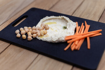 Gourmet Hummus Platter Photography - Chef-Styled with Fresh Vegetables on Black Slate, Overhead Flat Lay - Middle Eastern Cuisine, Healthy Dip Presentation