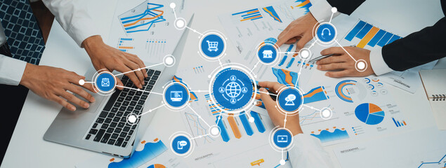 Professionals collaborate on data analysis with charts and graphs in a modern workspace, emphasizing strategic insights and business growth. Ideal for business projects. Amity