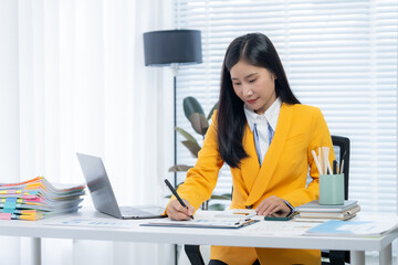 Focused Professional: A dedicated professional meticulously reviews and documents important...