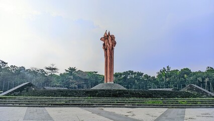 Tugu Kujang Sapasang at Monumen Bandung Lautan Api in Bandung, Indonesia. A tall flame-shaped sculpture symbolizing the 1946 heroic resistance

