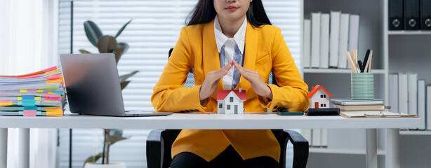 Real estate agent and couple enter into contracts for the sale of houses and land Approval of a contract to buy and sell a house Offers mortgage loans and home insurance ideas.