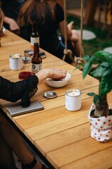 Top Down Flat Lay of Restaurant Table Scene with Shared Plates, Drinks, and People's Hands Dining Together, Lifestyle Overhead Shot