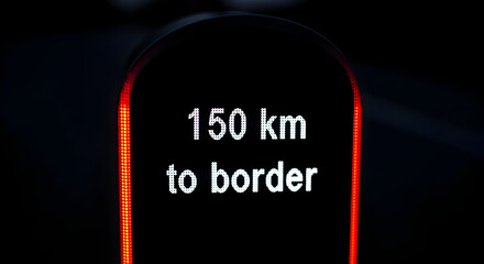 Digital Distance Reminder Displays 150 Kilometers to Border on Road Trip