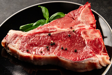 Raw steak T-bone fresh meat premium beef snack fresh delicious gourmet food background on the table rustic food top view copy space