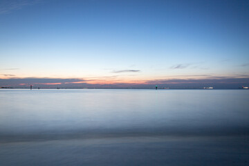 sunset over the bay bridge tunnel