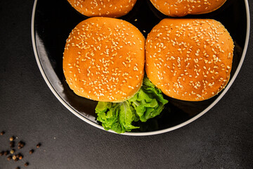 Bun burger puffy soft buns baking fresh delicious gourmet food background on the table rustic food...