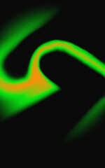Abstract swirling green and orange light trails on a black background