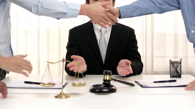 Corporate attorney applaud as business people make a successful deal or agreement with handshake, celebrating mutually beneficial acquisition. Business handshaking concept. Slow motion. Rigid.