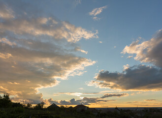 Landscape at sunset. Tragic gloomy sky. Panorama. Crimson twilight.