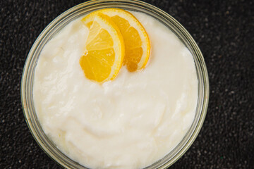 Lemon yogurt natural product skyr sour milk skir fresh delicious gourmet food background on the table rustic food top view copy space keto and paleo diet vegetarian food