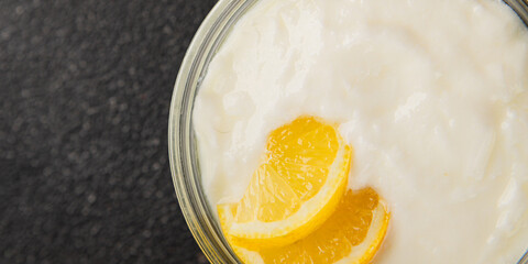 Lemon yogurt natural product skyr sour milk skir fresh delicious gourmet food background on the table rustic food top view copy space keto and paleo diet vegetarian food