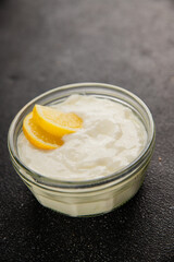 Lemon yogurt natural product skyr sour milk skir fresh delicious gourmet food background on the table rustic food top view copy space keto and paleo diet vegetarian food