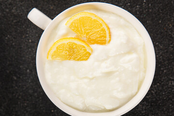 Lemon yogurt natural product skyr sour milk skir fresh delicious gourmet food background on the table rustic food top view copy space keto and paleo diet vegetarian food