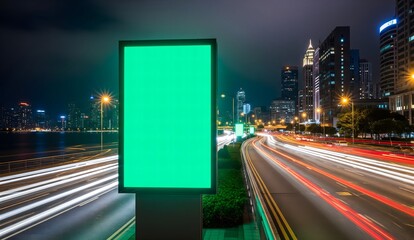 Timelapse green screen billboard on waterfront with night traffic. Vertical lightbox with chroma key on city street
