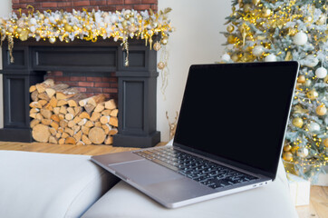 Christmas shopping online and sales. Laptop with empty screen and stylish christmas gifts on...
