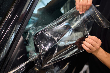Applying a Protective Film on the Surface of Your Car for Enhanced Durability and Shine