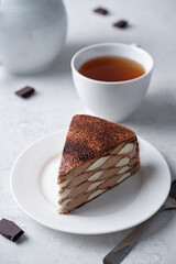 Chocolate vanilla crepe cake with whipped cream filling in the plate