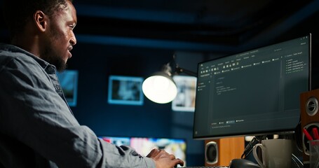 Developer enters binary data on terminal panel while he establishes html code. Software engineer working from home on troubleshooting with programming language, encryption. Camera A.