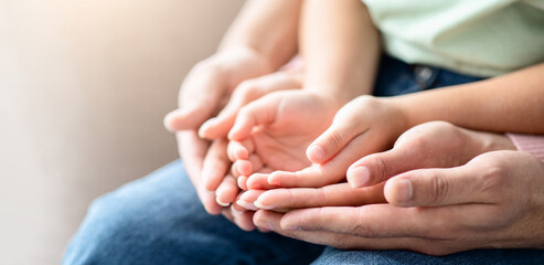 Closeup Shot Of Mom, Dad And Child Placing Their Hands Together, Unrecognizable Family Of Three Expressing Unity, Love, Care And Support, Selective Focus At Three Pair Of Palms, Cropped Image