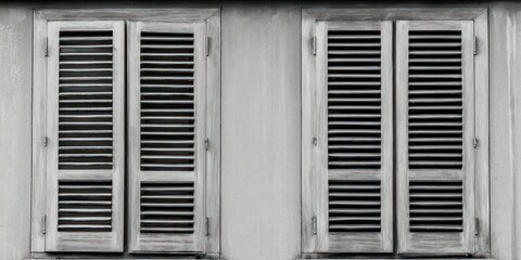 Fototapeta premium Rustic wooden shutters framing the charm of a time-worn architectural masterpiece at dusk