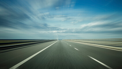 An empty highway on a partial cloudy summer day as symbol of focus on the goal