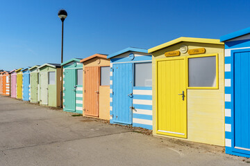 Naklejka premium Colourful beach huts in Seaford, East Sussex. 