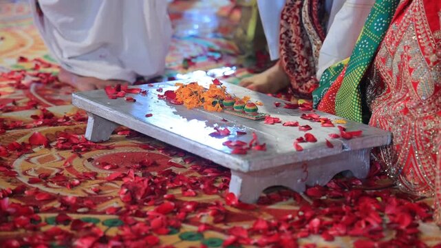 Authentic scene of a traditional Indian marriage vidhi, capturing sacred rituals performed around the holy fire (Agni) under a decorated mandap