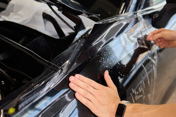 Applying a Protective Film on the Surface of Your Car for Enhanced Durability and Shine