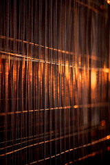 Portable fence made of galvanized steel with thin wire. A fence in the form of thin wire grids, shimmering in the rays of the setting sun. Vertical Frame