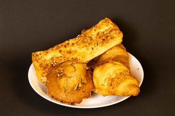 Fresh Croissant with Berries and Banana on a Bright Yellow Background